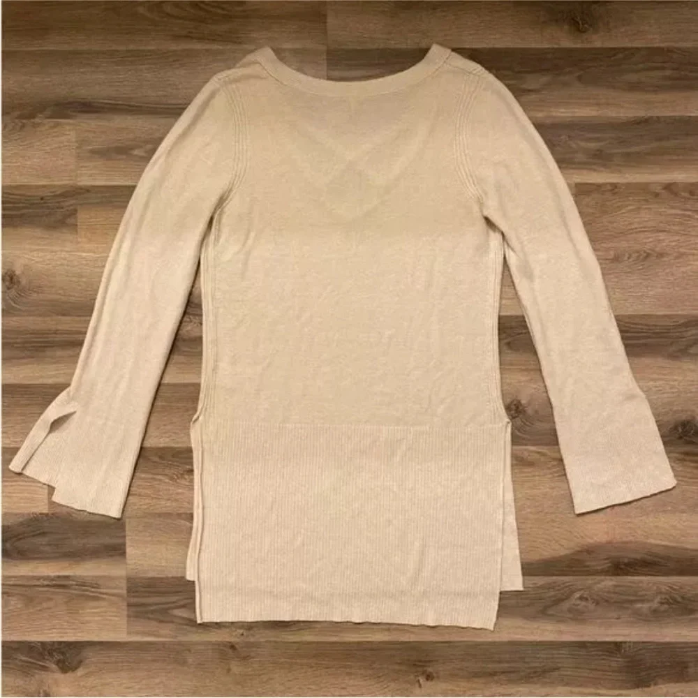 Free People cream color bell sleeve sweater with deep V-neck side slits linen b…